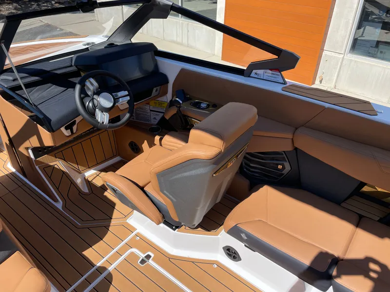 Slide: The Image of 2025 Nautique G23 interior with luxurious leather seating. - 6