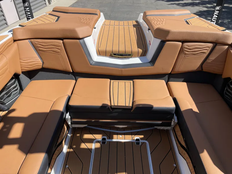 Slide: The Image of Interior of 2025 Nautique G23 with luxurious leather seating. - 8
