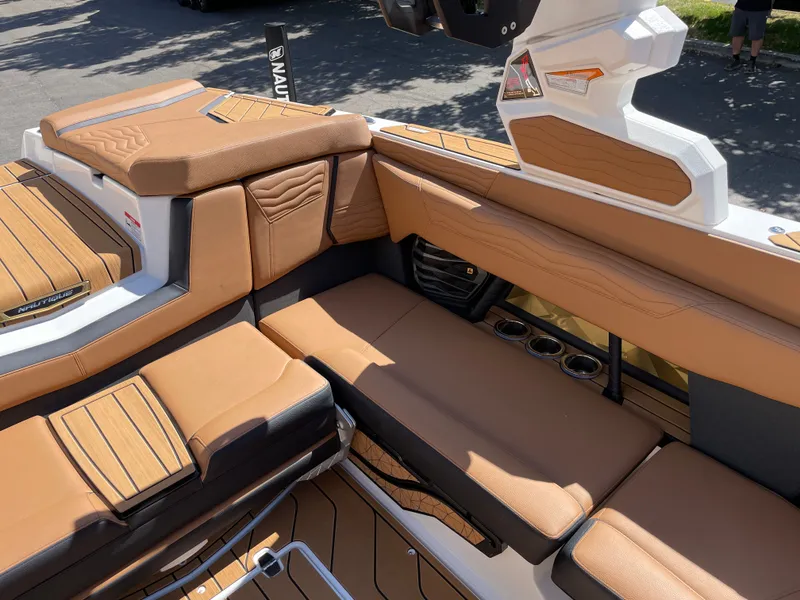 Slide: The Image of Interior of 2025 Nautique G23 with luxurious leather seating. - 9