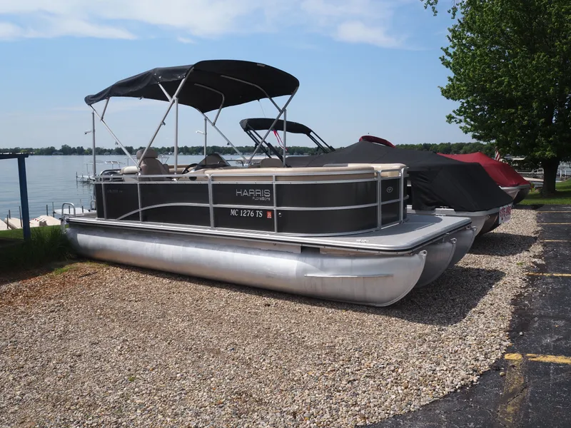 The Image of 2013 Harris CX 220 pontoon boat parked by the lakeside. - 1