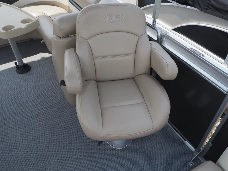 Slide: The Image of Beige captain's chair on a 2013 Harris CX 220 boat. - 10