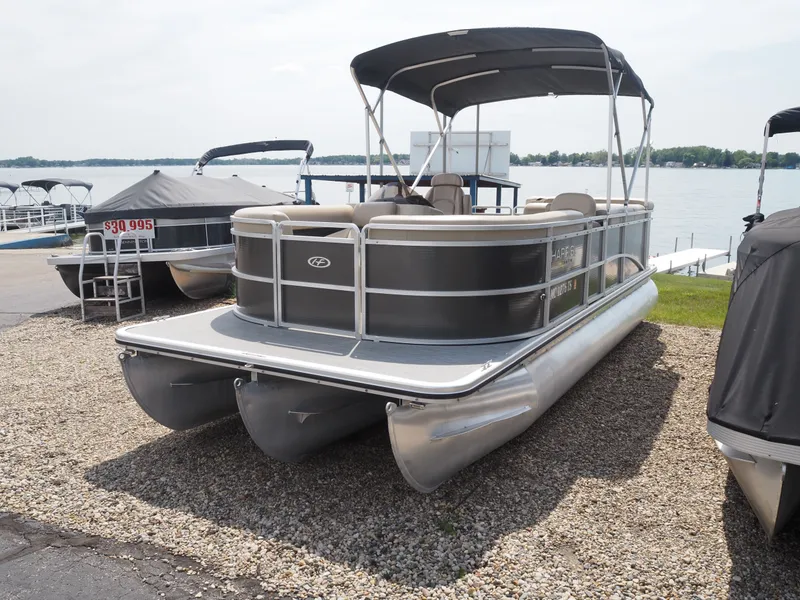 Slide: The Image of 2013 Harris CX 220 pontoon boat parked by the lakeside. - 3