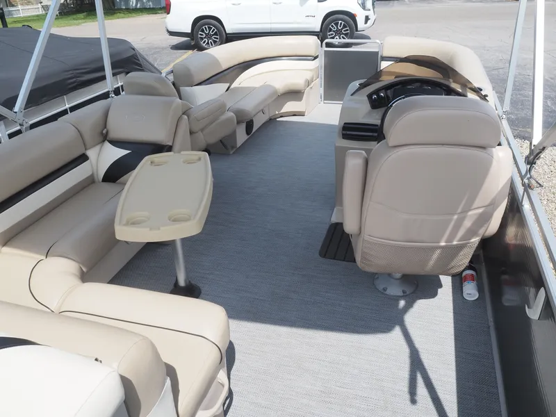 Slide: The Image of Interior of a 2013 Harris CX 220 pontoon boat with beige seating. - 5