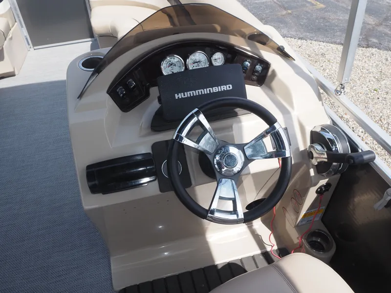 Slide: The Image of Steering console of a 2013 Harris CX 220 boat. - 6