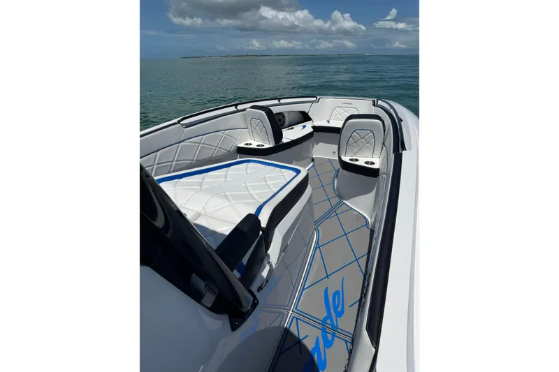 Slide: The Image of 2024 Renegade 38 Open boat interior with luxurious seating and ocean view. - 18