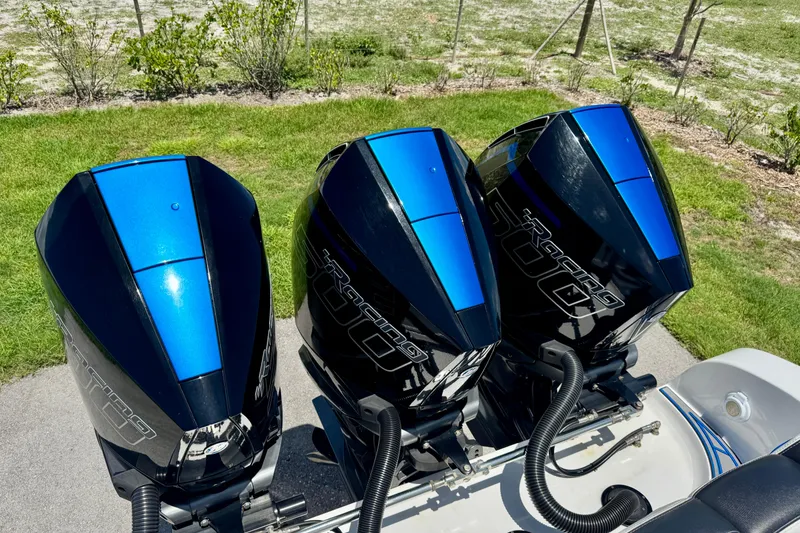 Slide: The Image of Triple Mercury Racing 300R outboard engines on a 2024 Renegade 38 Open boat. - 20