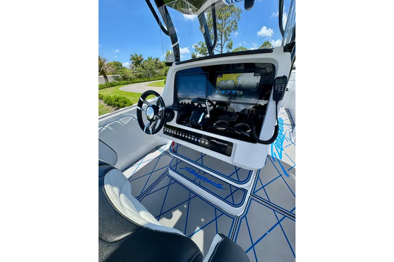 Slide: The Image of 2024 Renegade 38 Open boat cockpit with advanced navigation system and sleek design. - 23