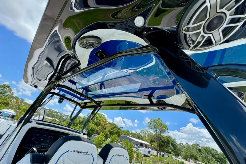 Slide: The Image of 2024 Renegade 38 Open boat interior with sleek design and advanced audio system. - 24