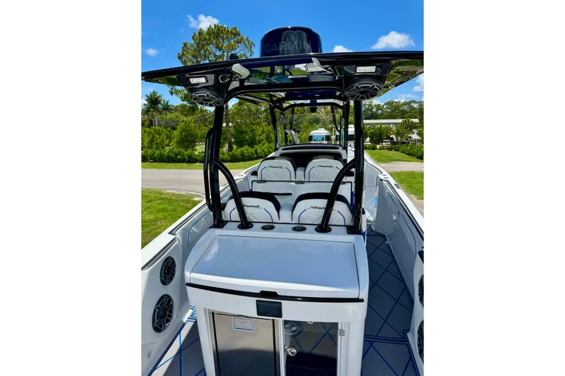 Slide: The Image of 2024 Renegade 38 Open boat with sleek design and modern features, docked outdoors. - 27