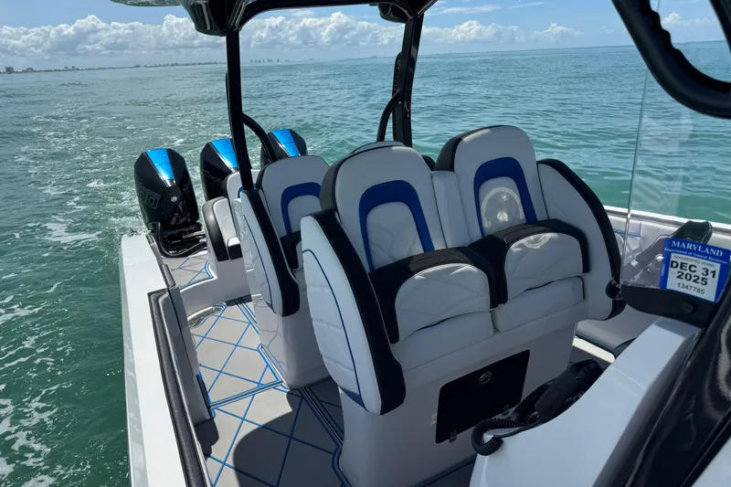 Slide: The Image of 2024 Renegade 38 Open boat with sleek seating and powerful engines on open water. - 29