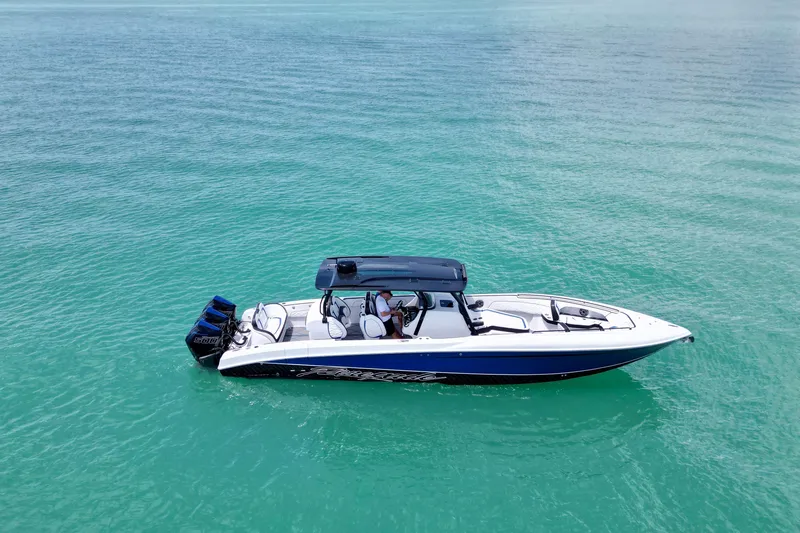 Slide: The Image of 2024 Renegade 38 Open boat on clear turquoise water. - 3