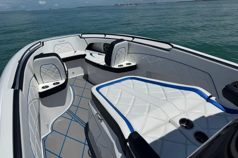 Slide: The Image of 2024 Renegade 38 Open boat interior with luxurious white seating and ocean view. - 34
