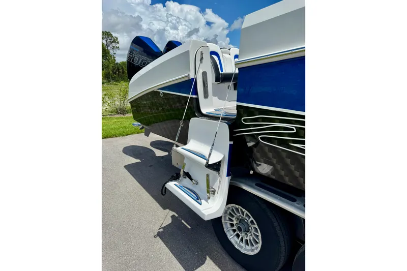Slide: The Image of 2024 Renegade 38 Open boat rear view with sleek design and powerful engines. - 38