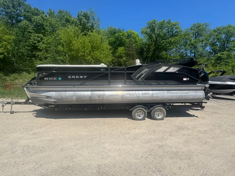 The Image of 2020 Crest Caribbean pontoon boat on trailer outdoors. - 1