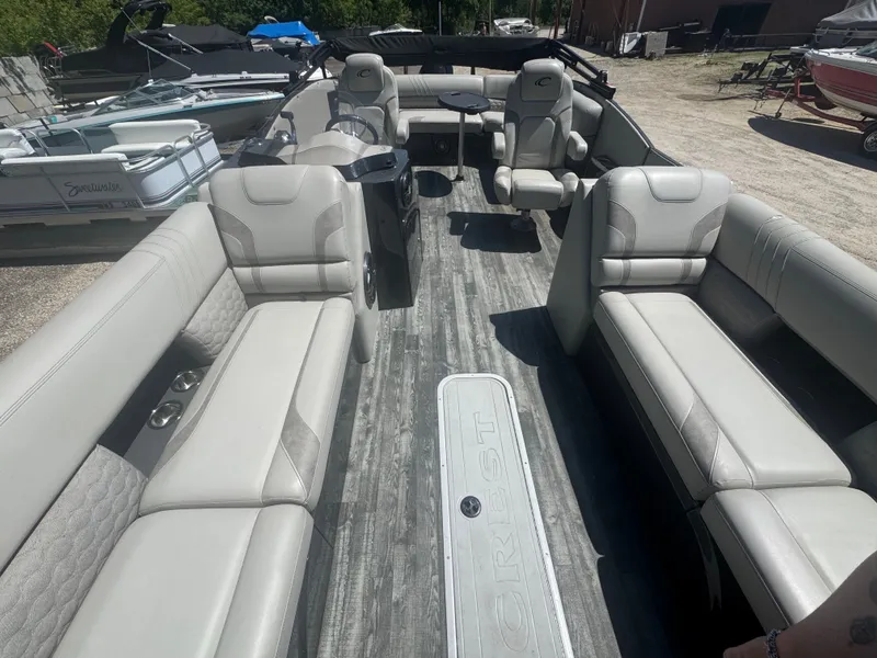 Slide: The Image of Interior of a 2020 Crest Caribbean pontoon boat with gray seating. - 11