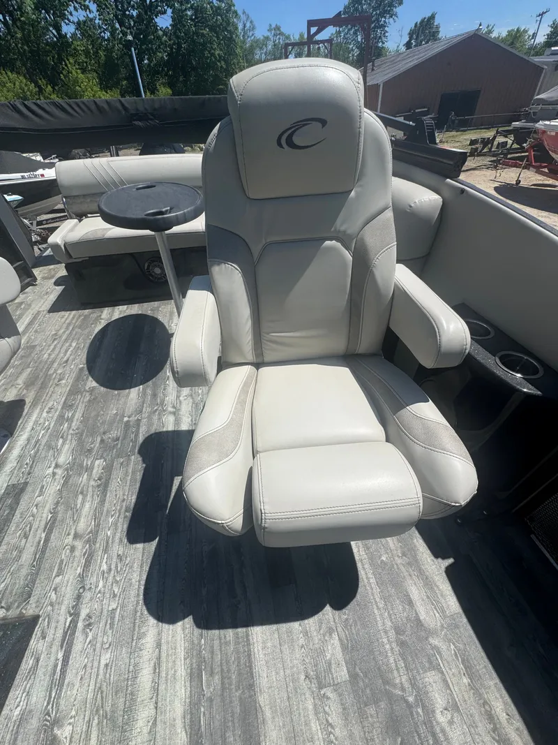 Slide: The Image of Crest Caribbean 2020 boat seat with gray upholstery and armrests. - 13