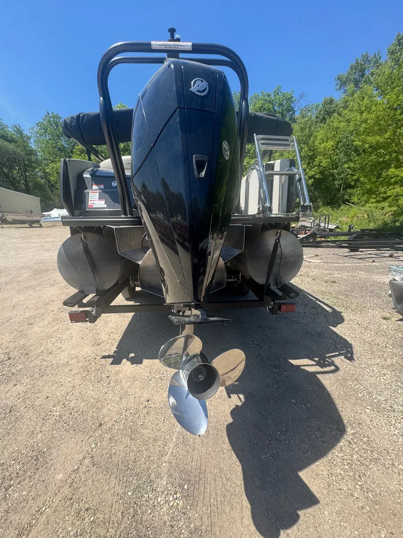 Slide: The Image of Rear view of a 2020 Crest Caribbean boat with outboard motor. - 3