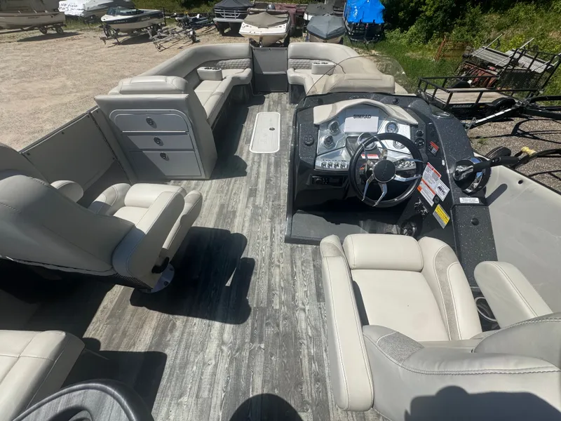 Slide: The Image of Interior of a 2020 Crest Caribbean pontoon boat with steering console. - 7