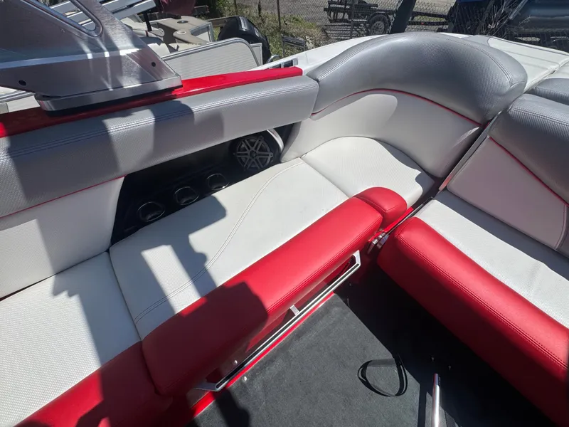 Slide: The Image of Interior of a 2017 MasterCraft XT23 with red and gray seating. - 19