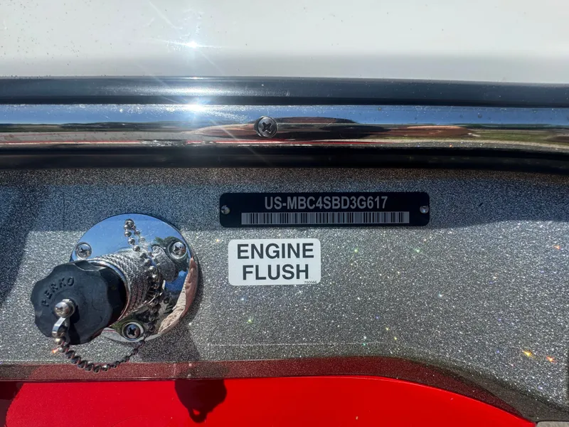 Slide: The Image of 2017 MasterCraft XT23 boat with engine flush port. - 24