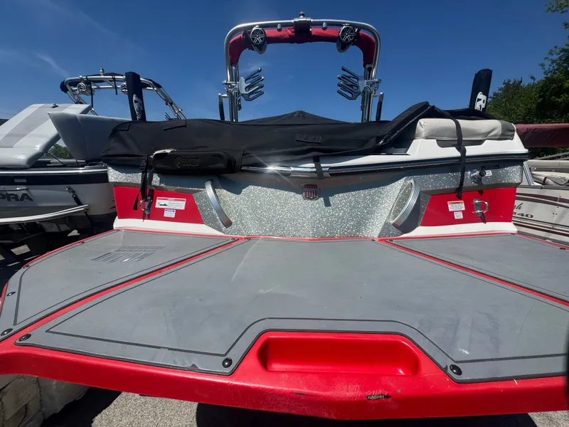 Slide: The Image of Red 2017 MasterCraft XT23 boat with sparkling rear. - 3
