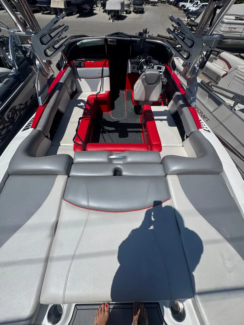 Slide: The Image of Interior of a 2017 MasterCraft XT23 boat with gray and red seating. - 5