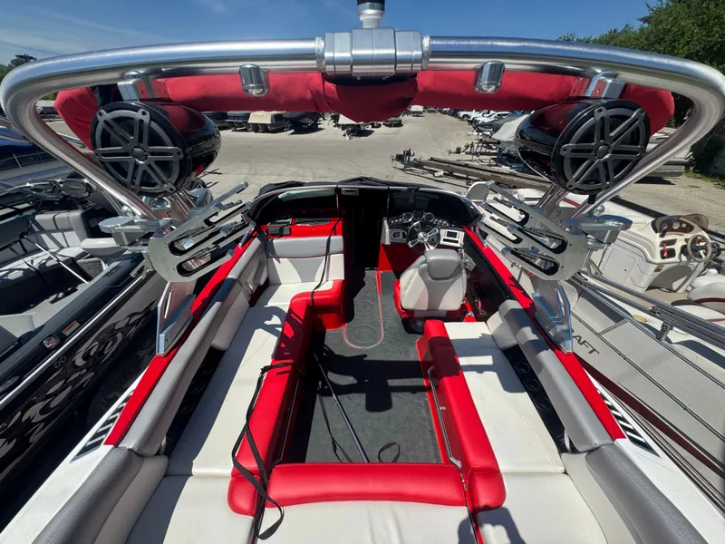 Slide: The Image of Interior view of a 2017 MasterCraft XT23 boat with red seating. - 6