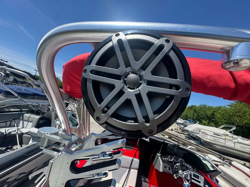 Slide: The Image of 2017 MasterCraft XT23 boat with speaker and red sunshade. - 7