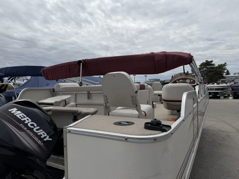 Slide: The Image of 2003 Starcraft 240 Starfish pontoon boat with Mercury outboard motor. - 3