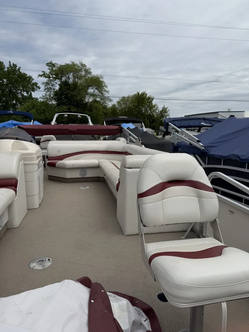 Slide: The Image of 2003 Starcraft 240 Starfish pontoon boat with white and red seating. - 4
