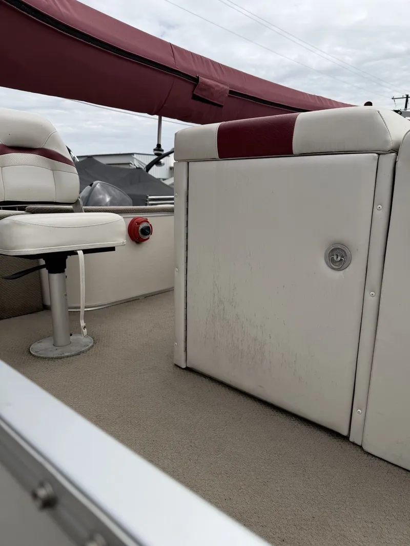 Slide: The Image of Interior of a 2003 Starcraft 240 Starfish boat with seating and storage. - 7