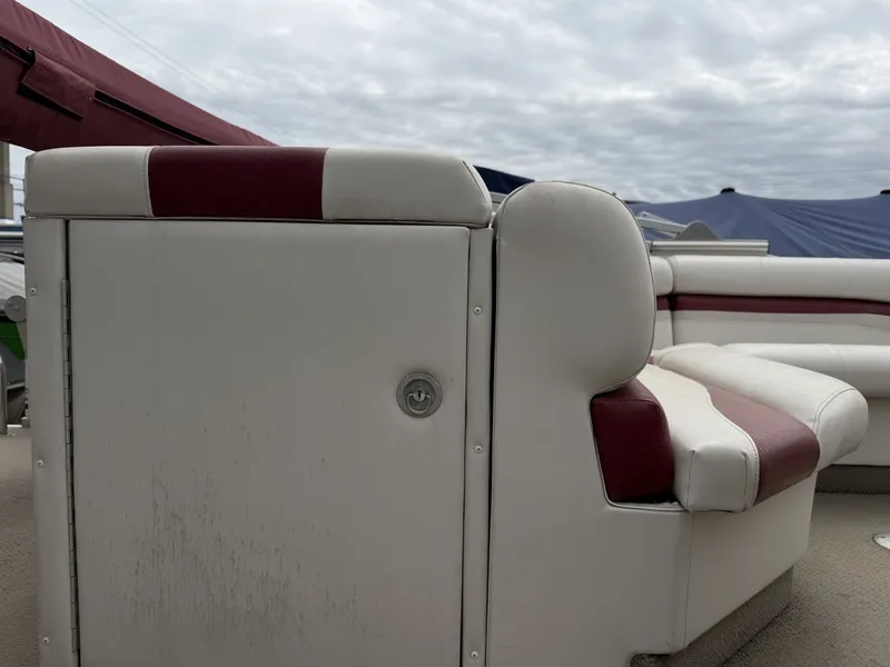 Slide: The Image of Interior of a 2003 Starcraft 240 Starfish boat with white and red seating. - 8