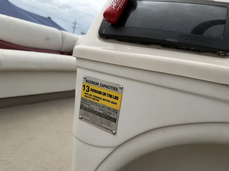 Slide: The Image of 2003 Starcraft 240 Starfish boat with capacity label for 13 persons. - 9