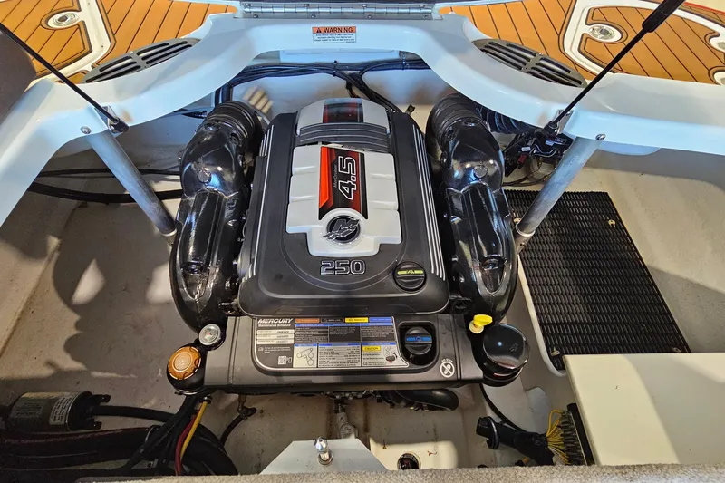 Slide: The Image of Engine compartment of a 2021 Monterey 224FS boat featuring a Mercury 4.5L 250 engine. - 26