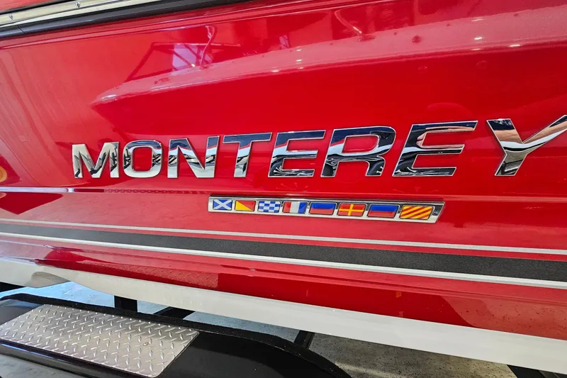 Slide: The Image of Red 2021 Monterey 224FS boat with chrome lettering and nautical flags. - 30