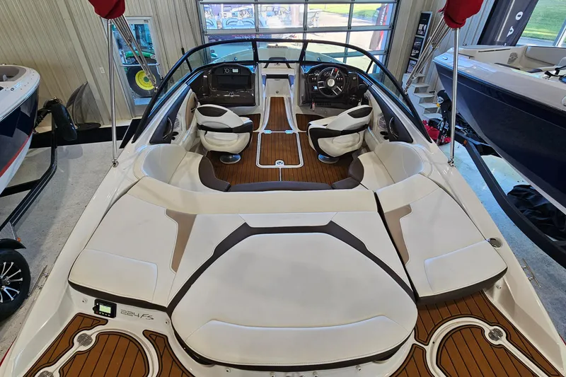 Slide: The Image of 2021 Monterey 224FS boat interior with sleek seating and modern dashboard design. - 6