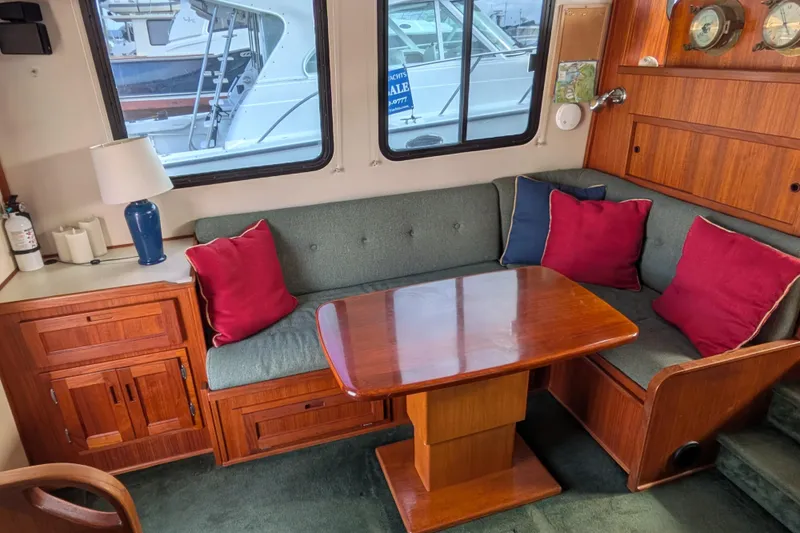 Slide: The Image of Interior of a 2001 Nordic Tug 37 boat with helm and seating area. - 24