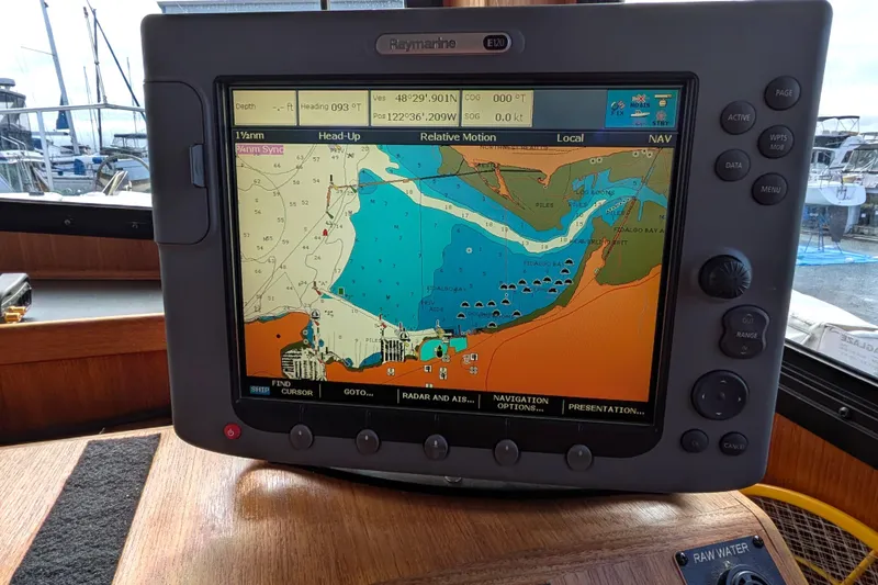 Slide: The Image of Cozy cabin interior of 2001 Nordic Tug 37 with wooden cabinetry and comfortable bedding. - 36