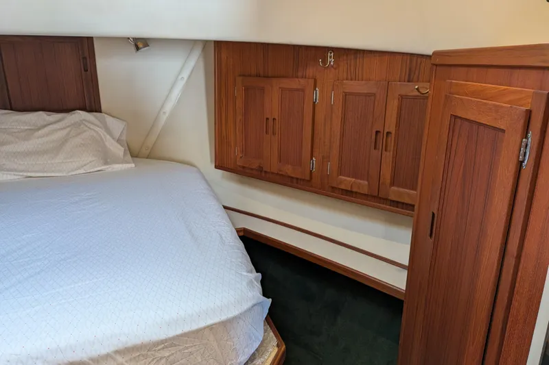Slide: The Image of Interior view of a 2001 Nordic Tug 37, featuring wooden doors and carpeted stairs. - 43