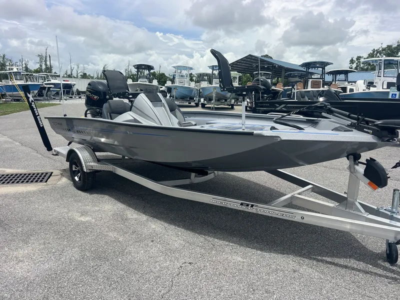 The Image of 2026 Xpress Hyper-Lift Crappie Series H18C boat on trailer. - 1