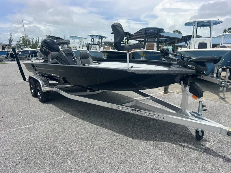 The Image of 2026 Xpress Hyper-Lift Bass Series H20 on trailer outdoors. - 1
