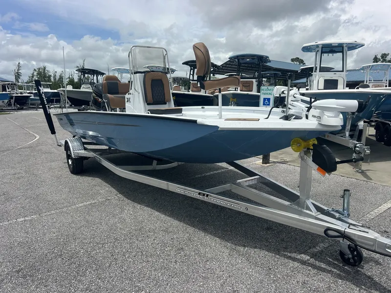 The Image of 2026 Xpress H20B Bay boat on trailer outdoors. - 1