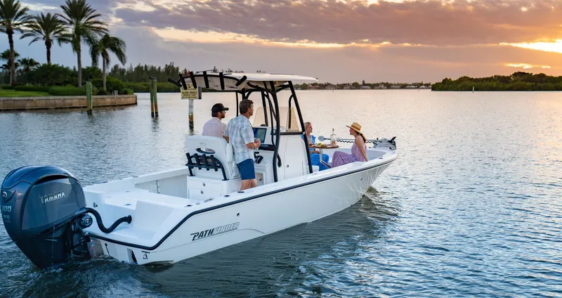 Slide: The Image of Pathfinder 2400 TRS boat 2027 cruising at sunset on the water. - 2
