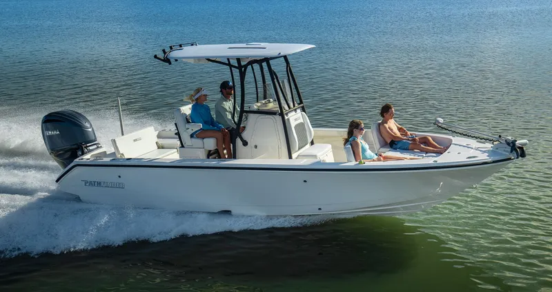 The Image of Pathfinder 2400 TRS 2027 boat on calm water with passengers. - 1