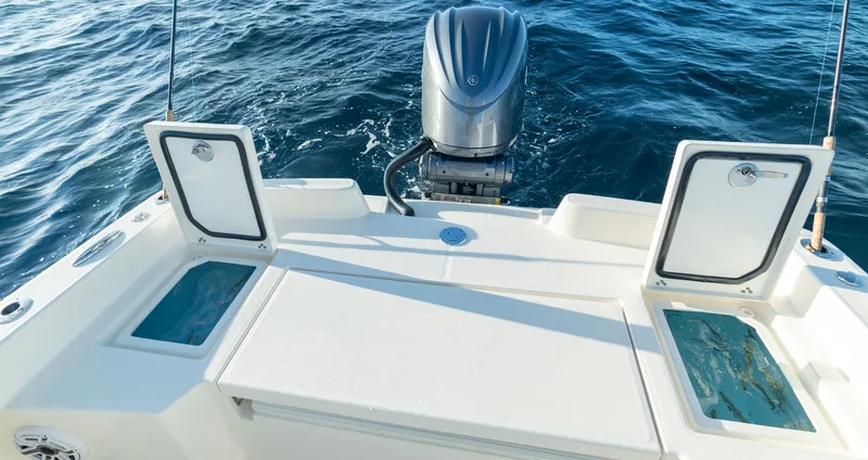 Slide: The Image of Pathfinder 2400 TRS 2027 boat with open storage on the water. - 4
