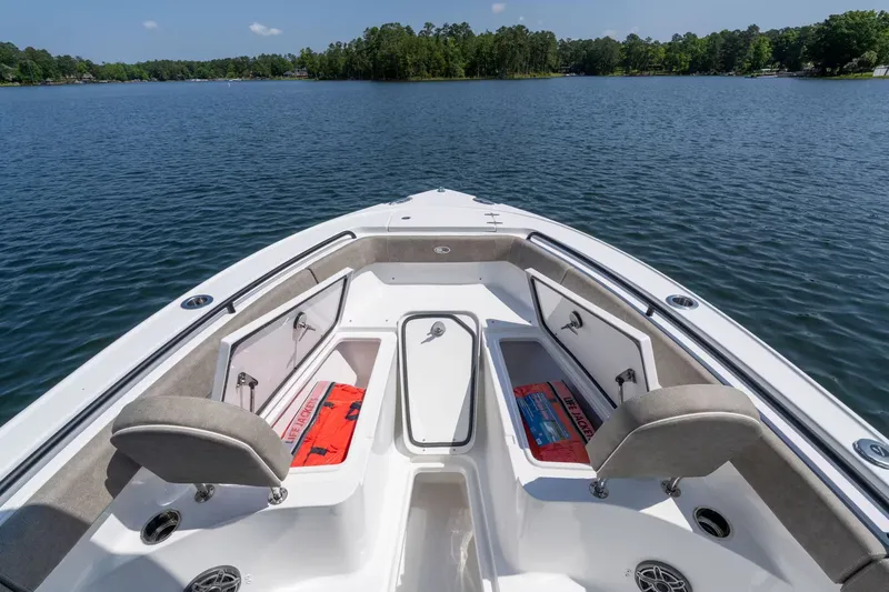Slide: The Image of Sea Hunt Ultra 255 SE 2027 on a tranquil lake. - 13