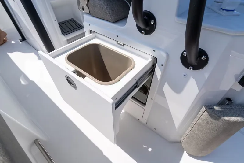 Slide: The Image of Sea Hunt Ultra 255 SE 2027 with open storage compartment. - 14