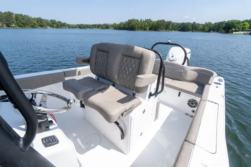 Slide: The Image of Interior view of Sea Hunt Ultra 255 SE boat, 2027 model, on a lake. - 8