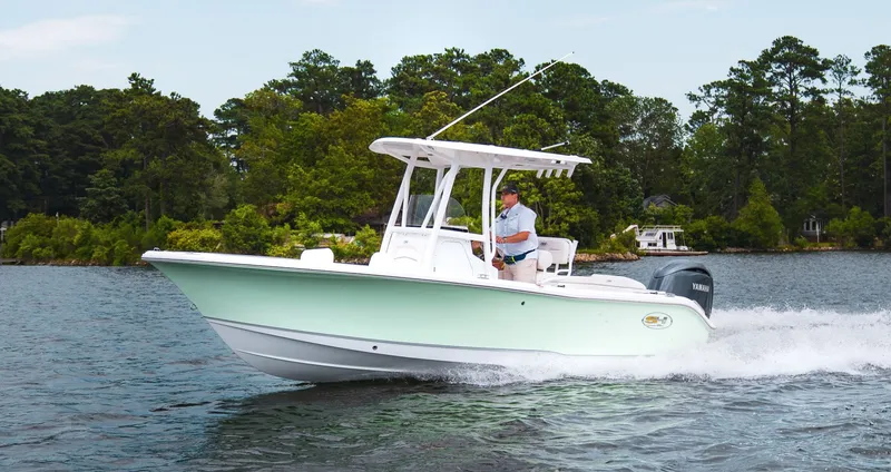 The Image of Sea Hunt Ultra 219 boat 2027 cruising on a lake. - 1