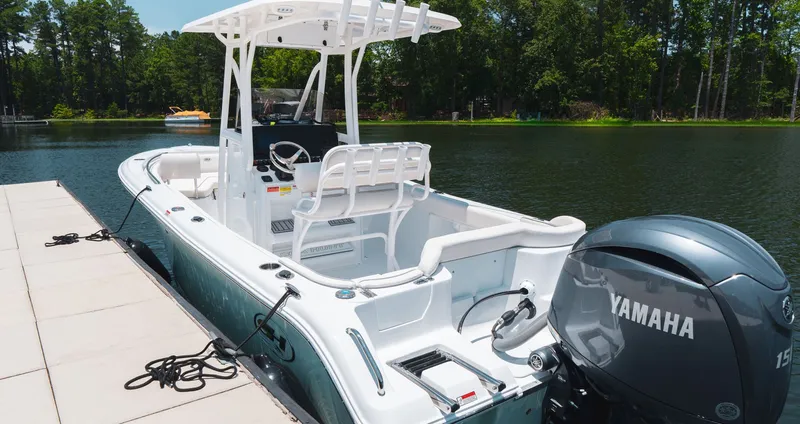 Slide: The Image of 2027 Sea Hunt Ultra 219 boat docked with Yamaha engine. - 13